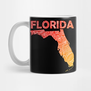 Colorful mandala art map of Florida with text in red and orange Mug